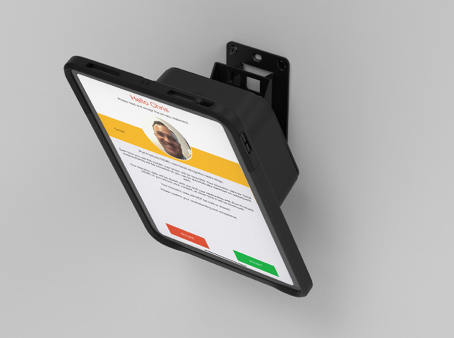 An iPad in an IPORT CONNECT Case on a VESA wall mount, running the clock-in screen